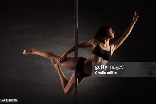 pole dance - pole dance stock pictures, royalty-free photos & images