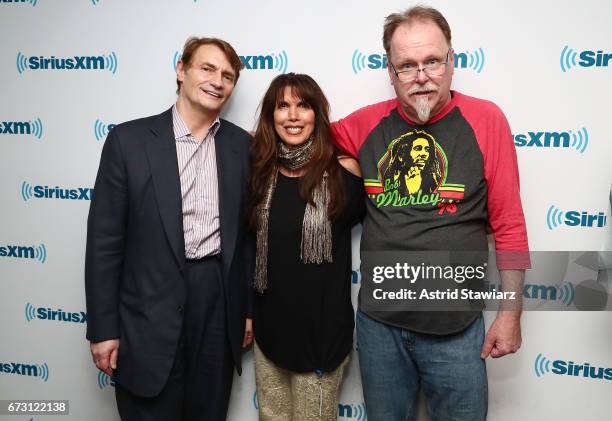 SiriusXM hosts Marc Benecke and Myra Scheer pose with Johnny Conaghan during a SiriusXM Town Hall taping on Studio 54 Radio celebrating the 40th...