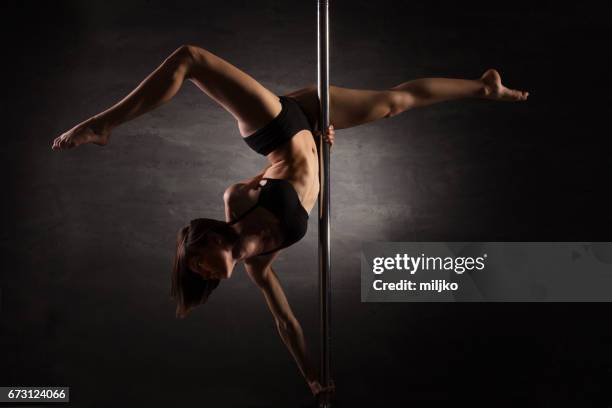 pole dance - pole dancing stock pictures, royalty-free photos & images