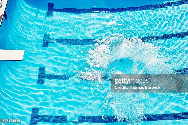 overhead view of splash in outdoor pool - diving board stock pictures, royalty-free photos & images