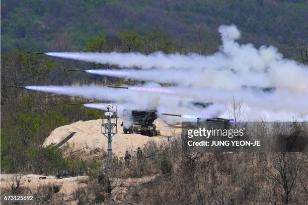 South Korean K-136 Kooryong 130mm 36-round multiple rocket launch system fire rockets during a joint live firing drill between South Korea and the US...