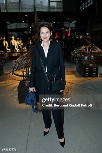 Dayle Haddon poses in front the works of Jean-Paul Goude during the "Societe des Amis du Musee d'Art Moderne du Centre Pompidou" : Dinner Party. Held...