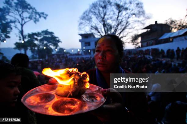 Devotees offering butter lamps during the Mother's Day celebration at Matatritha temple in Kathmandu, Nepal on Wednesday, April 26, 2017. Mother's...