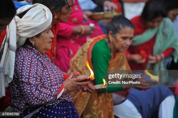 Devotees offering butter lamps during the Mother's Day celebration at Matatritha temple in Kathmandu, Nepal on Wednesday, April 26, 2017. Mother's...