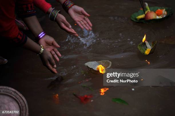 Devotees offering butter lamps during the Mother's Day celebration at Matatritha temple in Kathmandu, Nepal on Wednesday, April 26, 2017. Mother's...