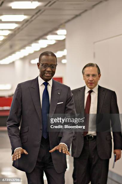 Tidjane Thiam, chief executive officer of Credit Suisse Group AG, left, arrives for a Bloomberg Television interview in Zurich, Switzerland, on...