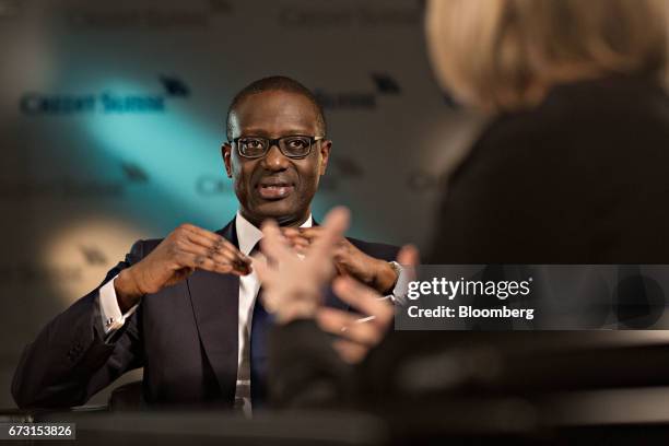 Tidjane Thiam, chief executive officer of Credit Suisse Group AG, speaks as Francine Lacqua, anchor for Bloomberg Television, listens during a...