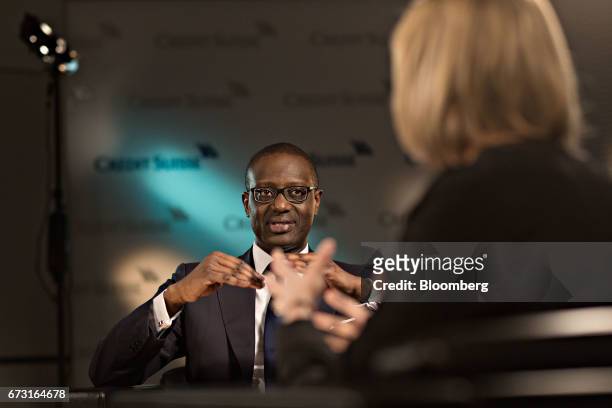 Tidjane Thiam, chief executive officer of Credit Suisse Group AG, speaks as Francine Lacqua, anchor for Bloomberg Television, listens during a...
