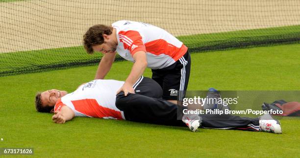 Chris Tremlett of England is treated by physiotherapist Ben Langley during a training session before Thursday's 3rd Test match against Sri Lanka at...