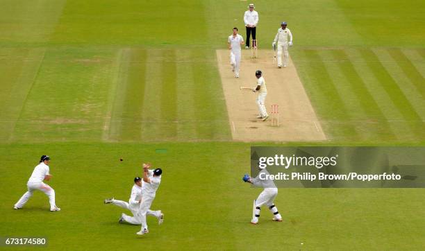 Andrew Strauss of England drops a chance from the bat of Rangana Herath of Sri Lanka as teammate Graeme Swann looks on during the 3rd Test match at...