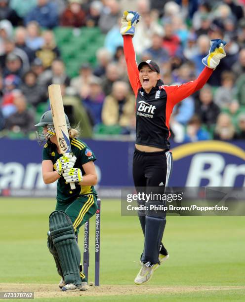 England's Sarah Taylor celebrates after catching Australia's Meg Lanning during the Women's quadrangular T20 cricket match at the County Ground in...