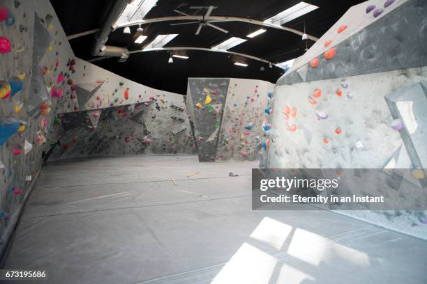 interior of climbing wall in climbing gym. - bouldering stock pictures, royalty-free photos & images