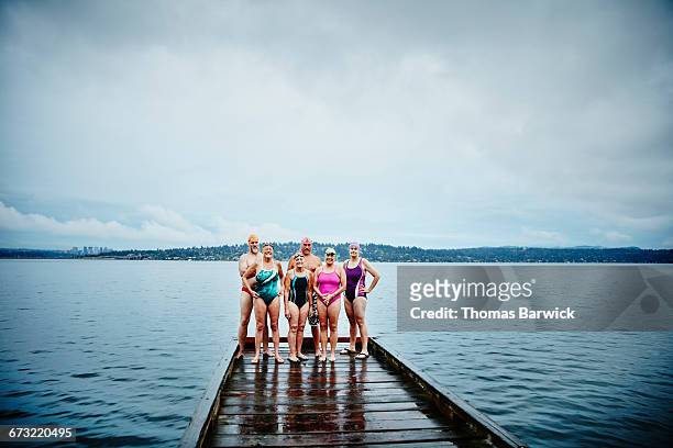 Portrait of swimmers on dock before morning swim
