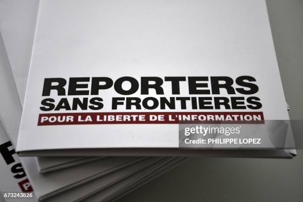 Picture taken on April 26, 2017 at the Agence France Presse headquarters in Paris shows copies of the annual World Press Freedom Index of Reporters...