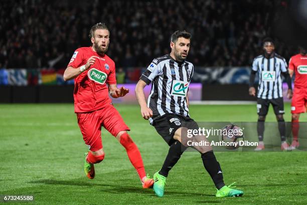 Thomas Mangani of Angers and Lucas Deaux of Guingamp during the Semi final of the French Cup match between Angers and Guingamp at Stade Jean Bouin on...