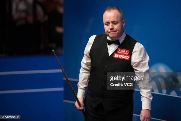John Higgins of Scotland reacts during his quarter-finals match against Kyren Wilson of England on day twelve of Betfred World Championship 2017 at...