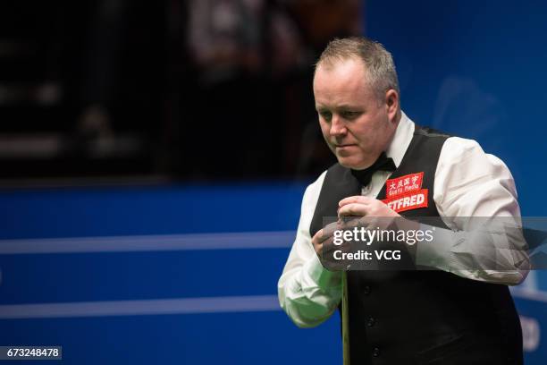 John Higgins of Scotland reacts during his quarter-finals match against Kyren Wilson of England on day twelve of Betfred World Championship 2017 at...