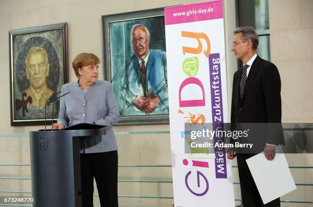 German Chancellor Angela Merkel speaks as Hannes Schwaderer, president of the D21 initiative, looks on on Girls' Day on April 26, 2017 in Berlin,...