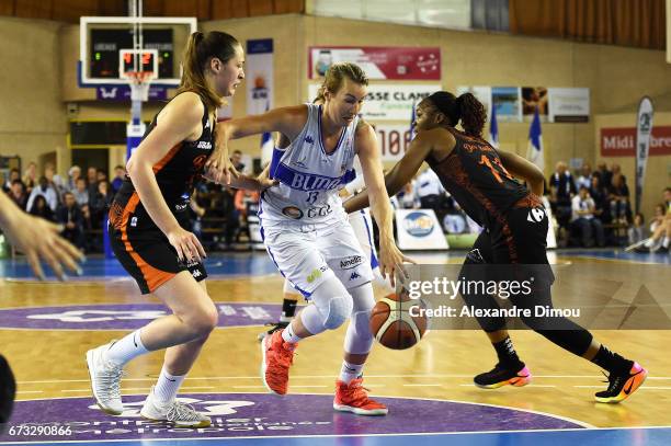 Elodie Godin of Montpellier and Alexia Chartereau and Clarissa Dos Santos of Bourges during the Women's basketball match between Lattes Montpellier...