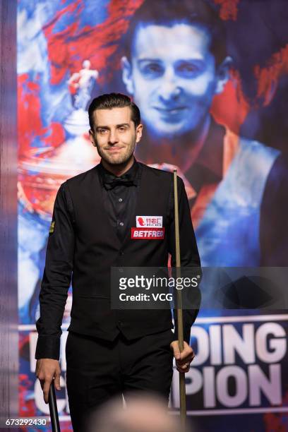 Mark Selby of England reacts during his quarter-finals match against Marco Fu of Chinese Hong Kong on day twelve of Betfred World Championship 2017...