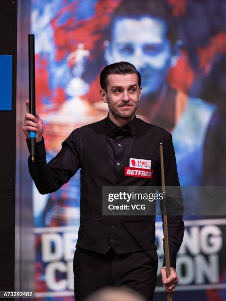 Mark Selby of England reacts during his quarter-finals match against Marco Fu of Chinese Hong Kong on day twelve of Betfred World Championship 2017...