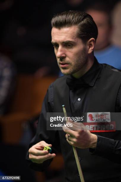 Mark Selby of England reacts during his quarter-finals match against Marco Fu of Chinese Hong Kong on day twelve of Betfred World Championship 2017...