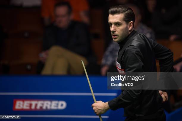 Mark Selby of England reacts during his quarter-finals match against Marco Fu of Chinese Hong Kong on day twelve of Betfred World Championship 2017...