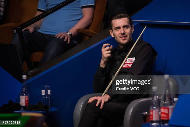 Mark Selby of England reacts during his quarter-finals match against Marco Fu of Chinese Hong Kong on day twelve of Betfred World Championship 2017...