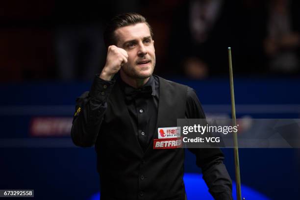 Mark Selby of England reacts during his quarter-finals match against Marco Fu of Chinese Hong Kong on day twelve of Betfred World Championship 2017...