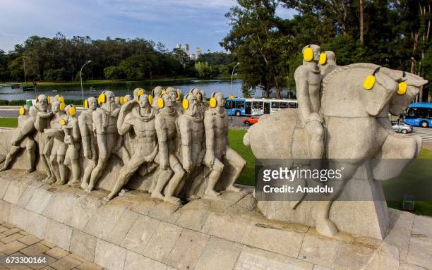 Monument to the Bandeiras is seen with yellow ear protectors on the "International Noise Awareness Day" in Sao Paulo, Brazil on April 26, 2017.