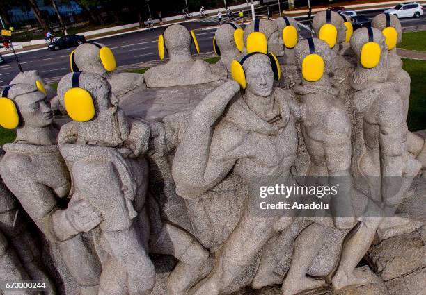 Monument to the Bandeiras is seen with yellow ear protectors on the "International Noise Awareness Day" in Sao Paulo, Brazil on April 26, 2017.