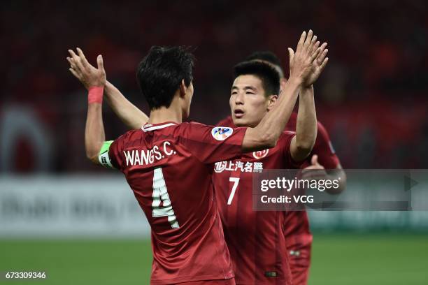 Wu Lei and Wang Shenchao of Shanghai SIPG celebrate a goal during 2017 AFC Champions League group match between Shanghai SIPG F.C. And F.C. Seoul at...
