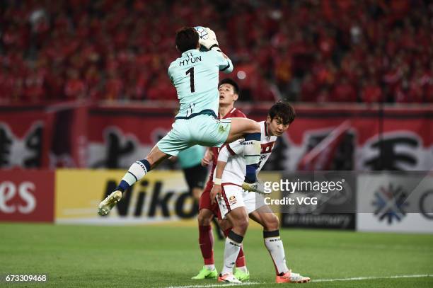 Yoo Hyun of FC Seoul jumps to catch the ball during 2017 AFC Champions League group match between Shanghai SIPG F.C. And F.C. Seoul at Shanghai...