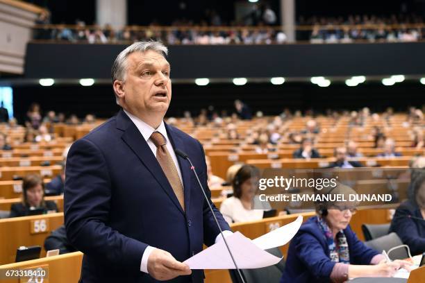 Hungary's Prime Minister Viktor Orban addresses the planery session at the European Parliament on the situation in Hungary, in Brussels on Avril 26,...