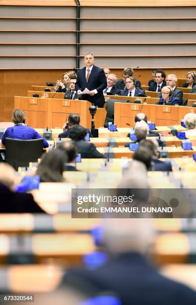 Hungary's Prime Minister Viktor Orban addresses the planery session at the European Parliament on the situation in Hungary, in Brussels on Avril 26,...