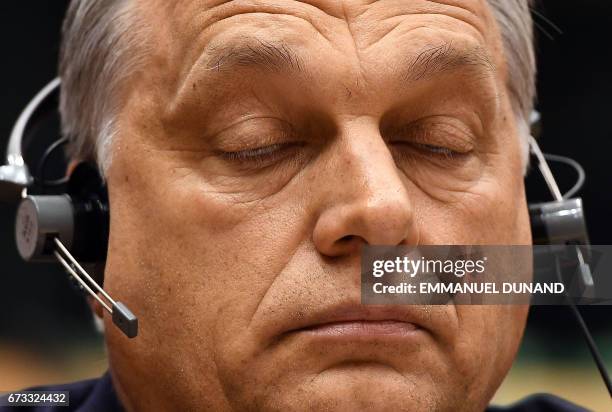 Hungary's Prime Minister Viktor Orban takes part in a planery session at the European Parliament on the situation in Hungary, in Brussels on Avril...