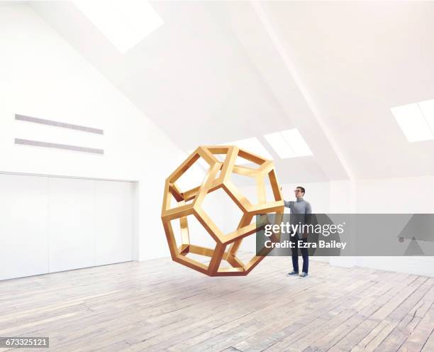 designer being inspired by an impossible shape. - 3d sculpture stock pictures, royalty-free photos & images