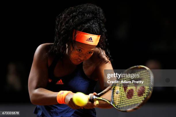 Naomi Osaka of Japan in action during her match against Johanna Konta of Great Britain during the Porsche Tennis Grand Prix at Porsche Arena on April...