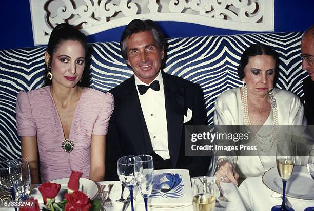 George Hamilton with his mother Ann Stevens & his date attend the Grand Opening of newly refurbished Club El Morocco circa 1987 in New York City.