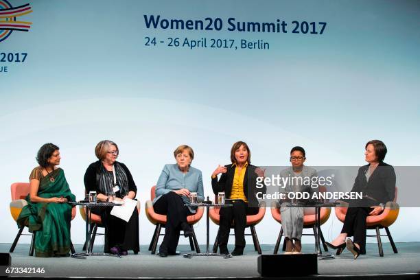 German Chancellor Angela Merkel attends a panel discussion with Sucharita Eashwar, Founder and CEO Catalyst for Women Entrepreneurs, , Sue Harris...