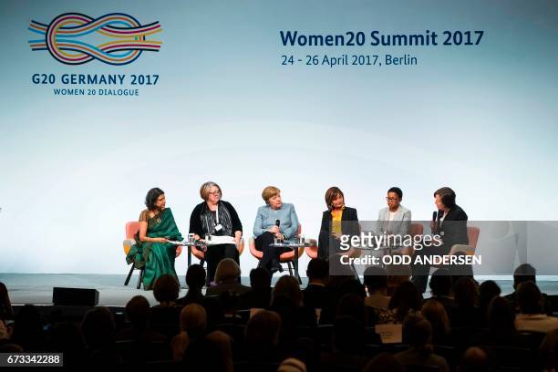 German Chancellor Angela Merkel attends a panel discussion with Sucharita Eashwar, Founder and CEO Catalyst for Women Entrepreneurs, , Sue Harris...