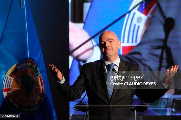 President Gianni Infantino gives a speech during the 67th Ordinary CONMEBOL Congress in Santiago, on April 26, 2017. / AFP PHOTO / CLAUDIO REYES