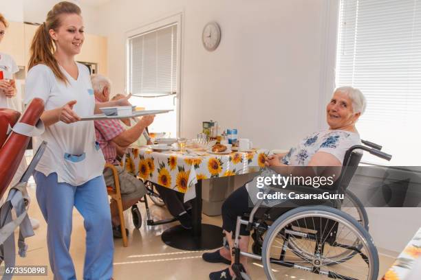 breakfast time for seniors in the retirement home - residential care stock pictures, royalty-free photos & images