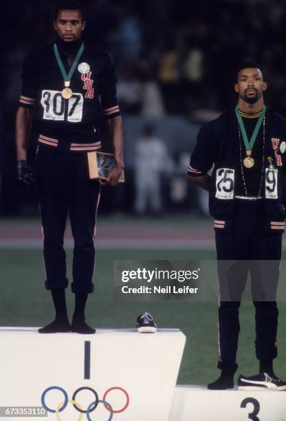 Summer Olympics: USA Tommie Smith and John Carlos during medal presentation for the Men's 200M at Estadio Olimpico. Tommie Smith and John Carlos wore...