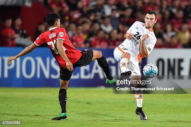 Wattana Playnum of Muangthong United and Nicholas D'Agostino Brisbane Roar competes for the ball during the AFC Asian Champions League Group Stage...