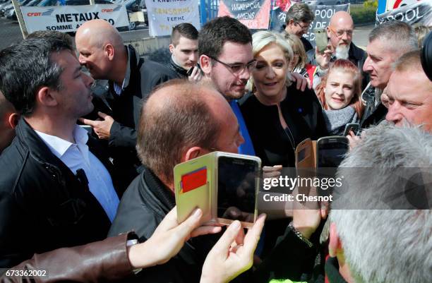 French far-right political party National Front and President French presidential election candidate, Marine Le Pen poses for selfies with strike...