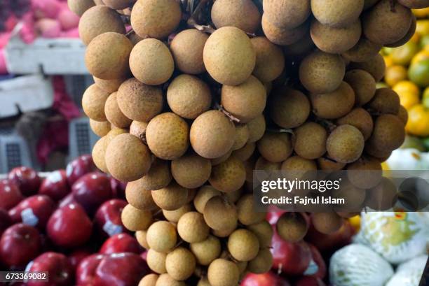 fresh longan on a local market - longan stock pictures, royalty-free photos & images
