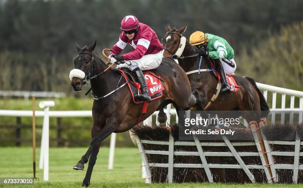 Kildare , Ireland - 26 April 2017; Champagne Classic, left, with Bryan Cooper up, jump the last on their way to winning the Irish Daily Mirror Novice...