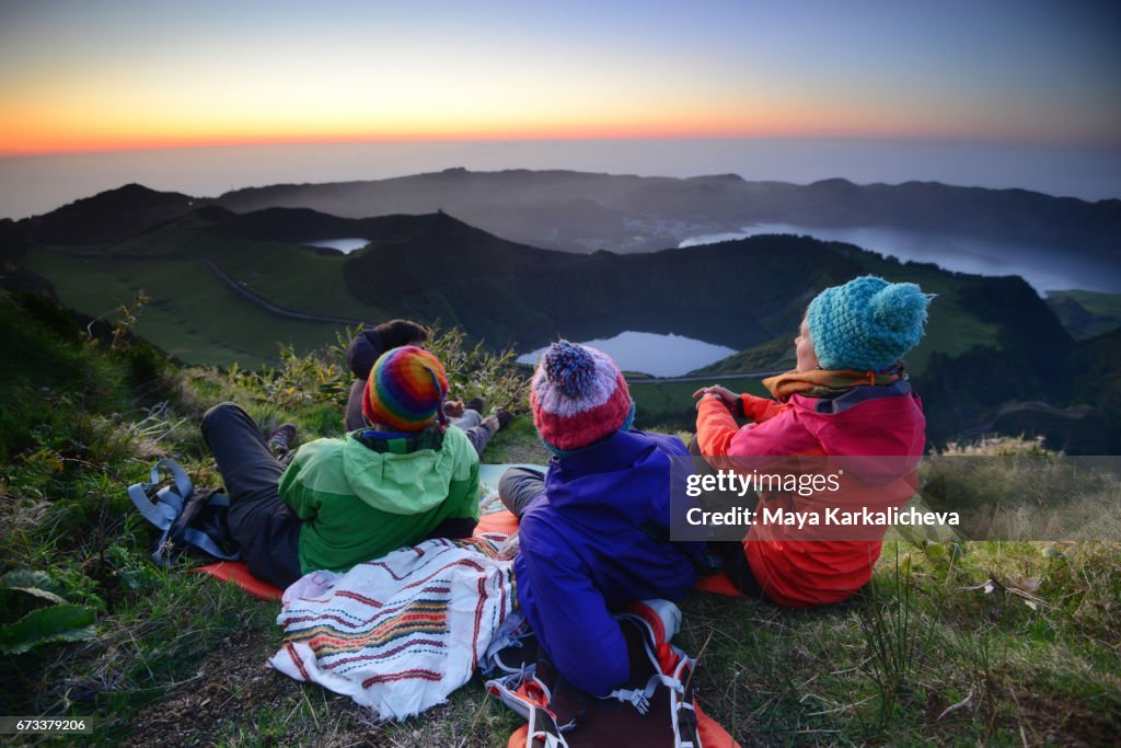 Three friends watching the sunset at Sete Cidades, Azores