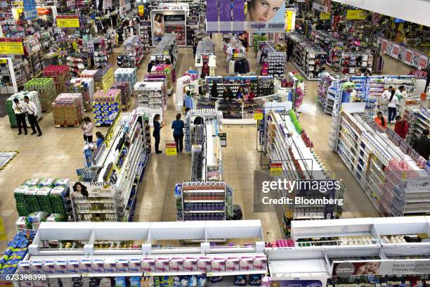 Shoppers view health and beauty care products for sale at an Almacenes Exito SA store in Bogota, Colombia, on Thursday, April 20, 2017. The...